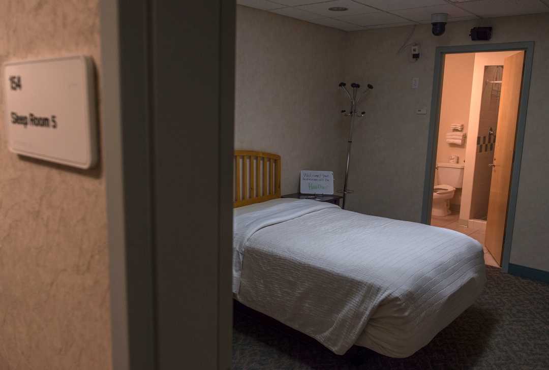 Bed in a room.