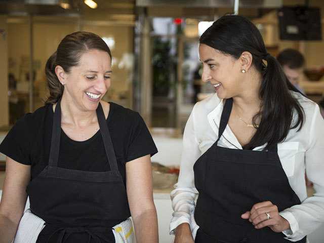 Two women cooking.