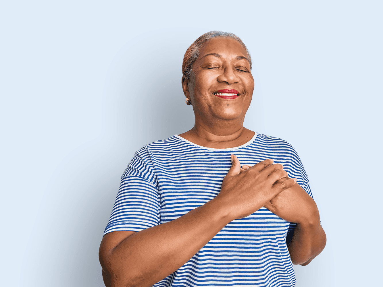 Woman with hands over heart