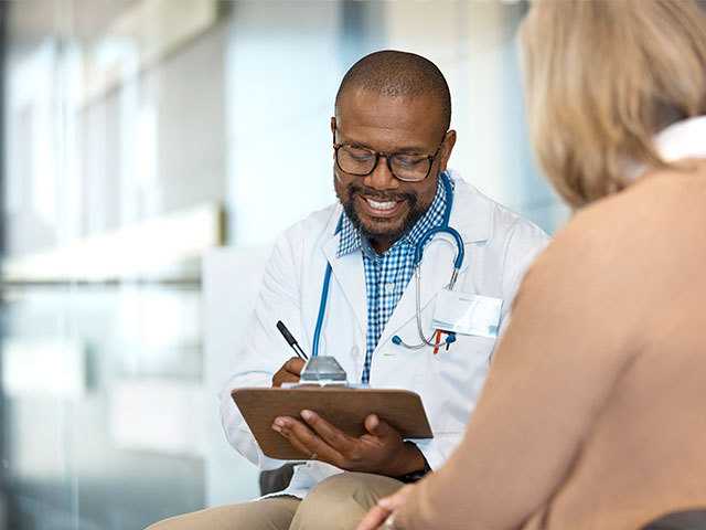 Healthcare provider consulting with patient.