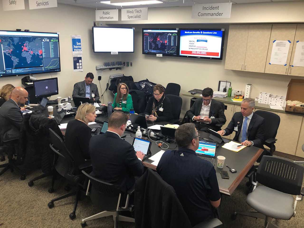 Group of people at conference table.