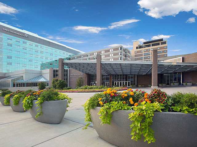 Butterworth Hospital main entrance with flowers