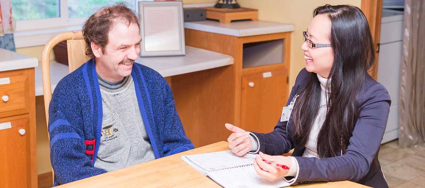 Person being visited by an at home care specialist