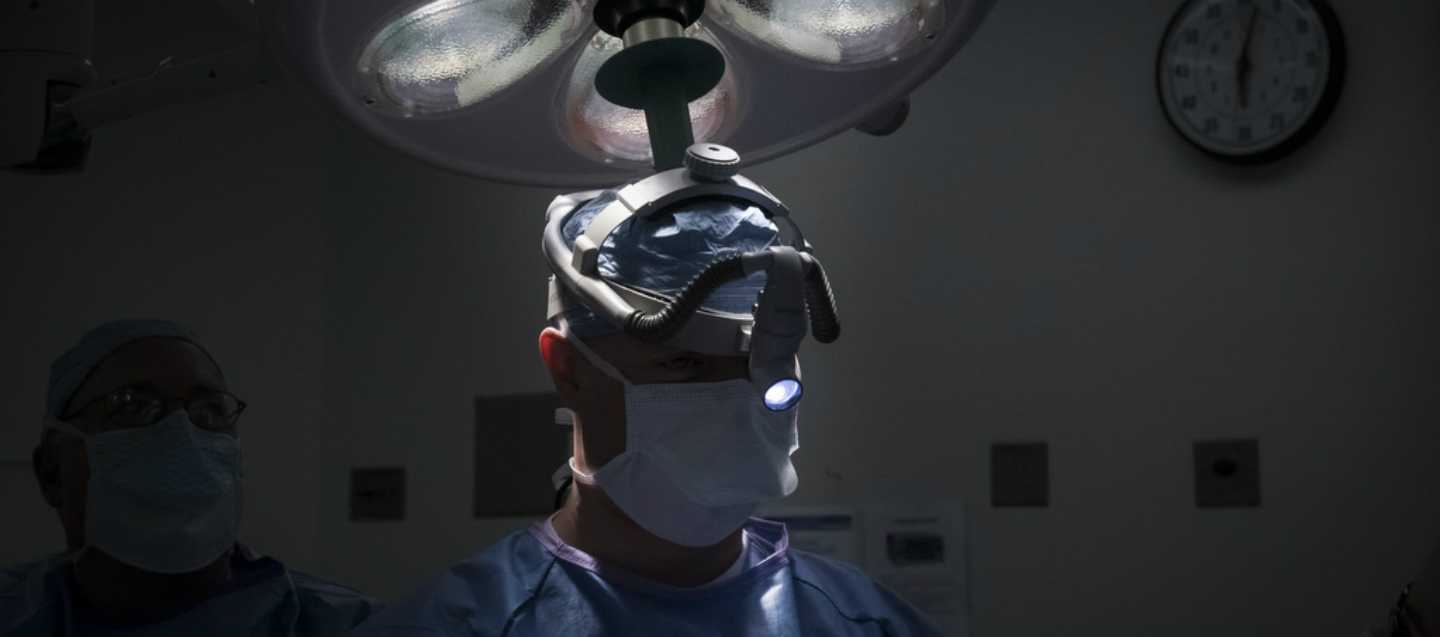 Doctor with a headlamp on