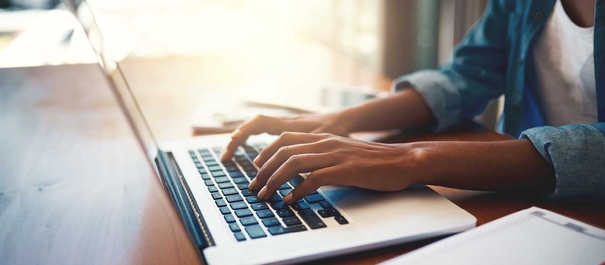 hands at a laptop keyboard