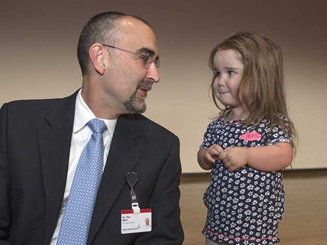 Doctor and toddler girl patient