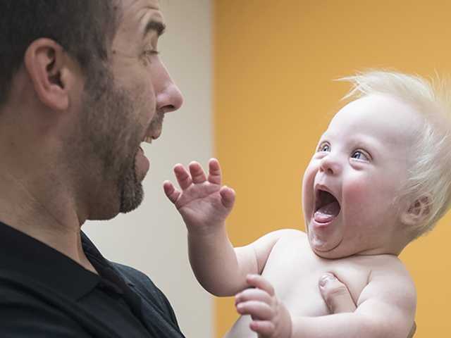 Man holding baby.