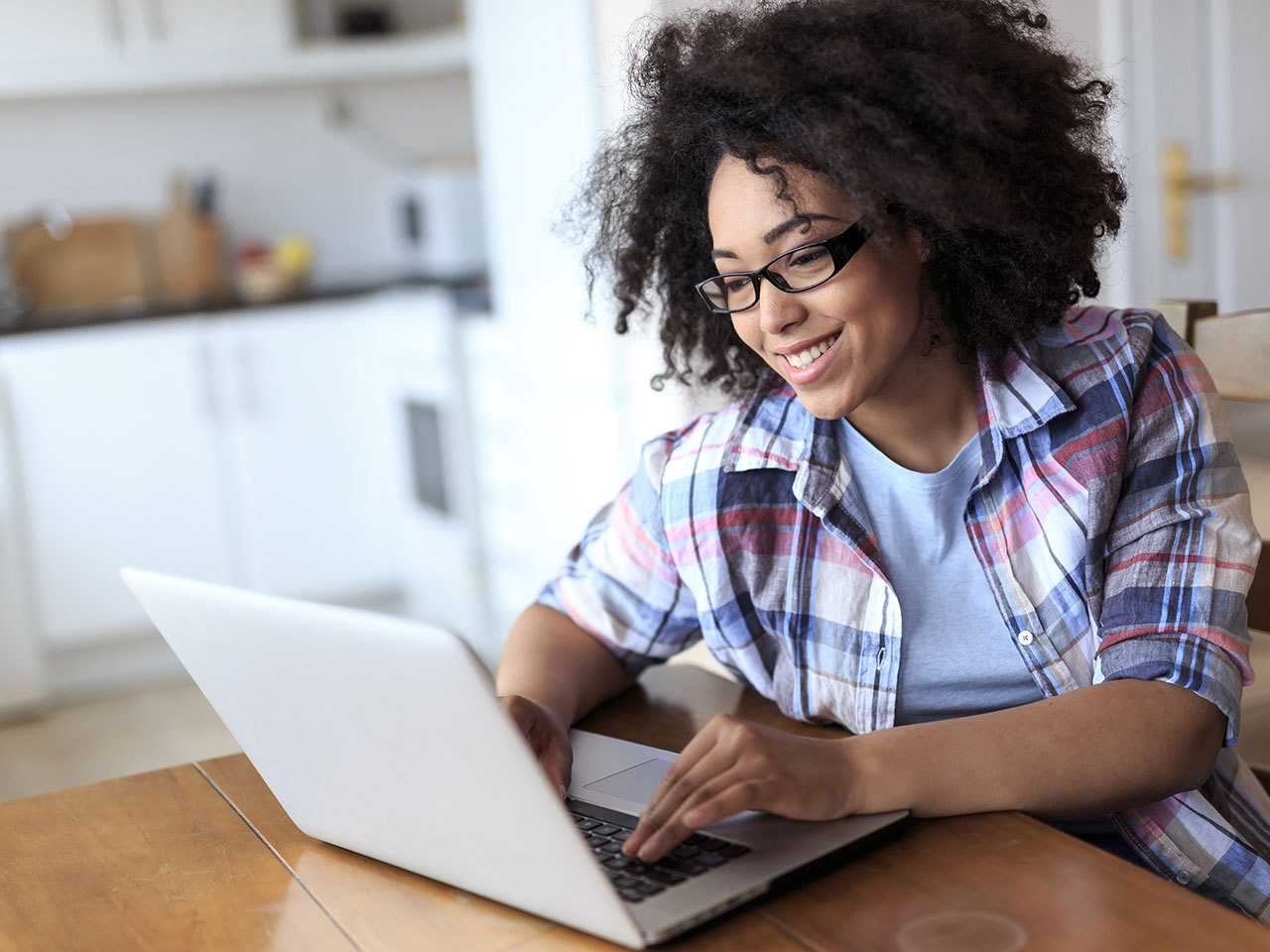 Woman working on laptop.