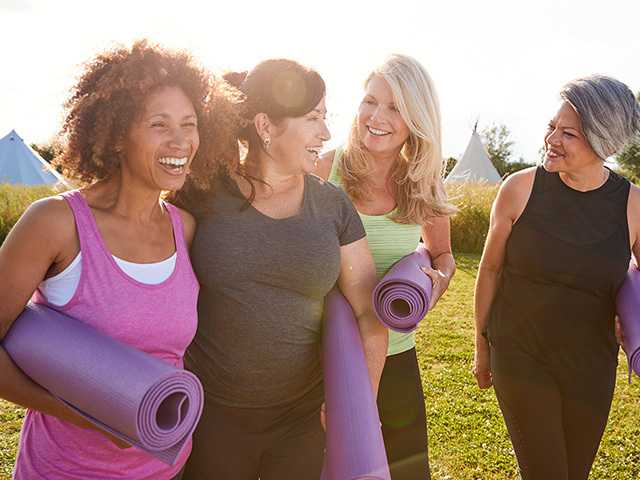 Group of women with yoga mats.