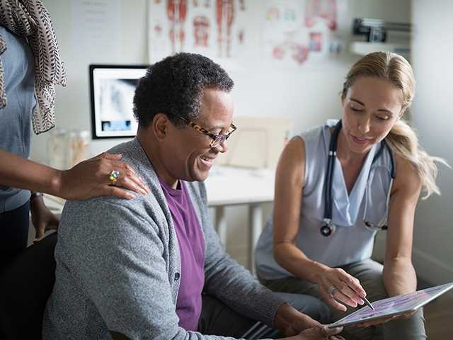 Healthcare provider talking to patient.