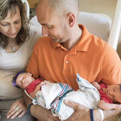 Mom and Dad with twins.