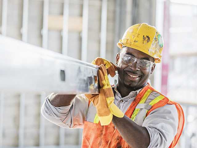 Smiling Man in Hardhat and Yellow Jacket